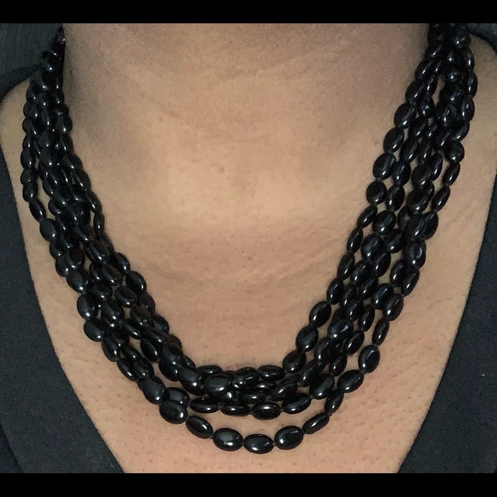 Black bead necklace. Pre-owned. Approx 10” long, with an extender.